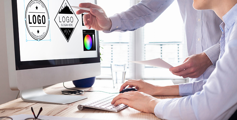 Designer-team-sketching-a-logo-in-digital-design-studio-on-computer,-creative-graphic-drawing-skills-for-marketing-and-branding-1013820482_3868x2578 Logo Designing - Promo Products